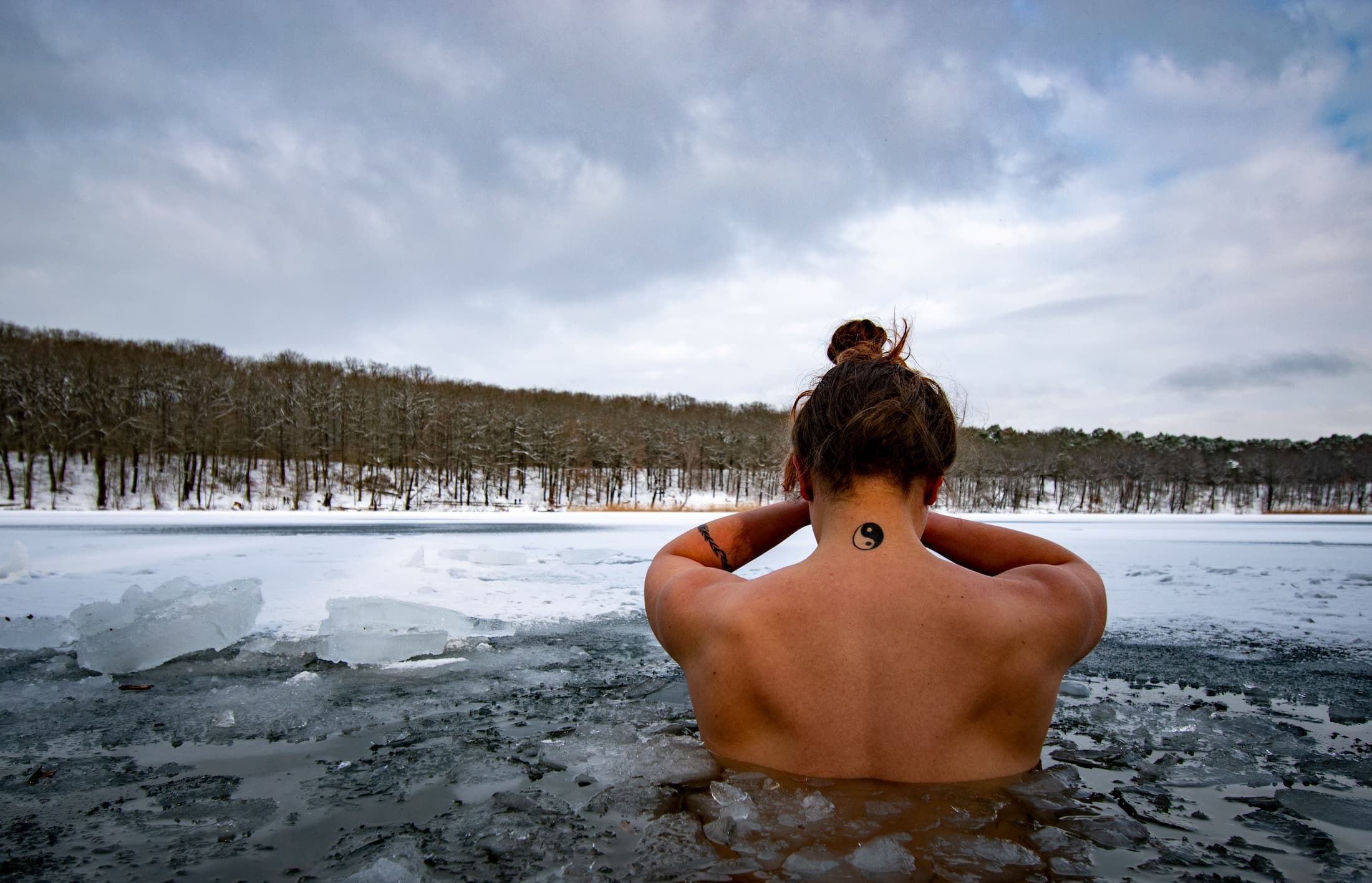 Yin Yang ice dip in lake